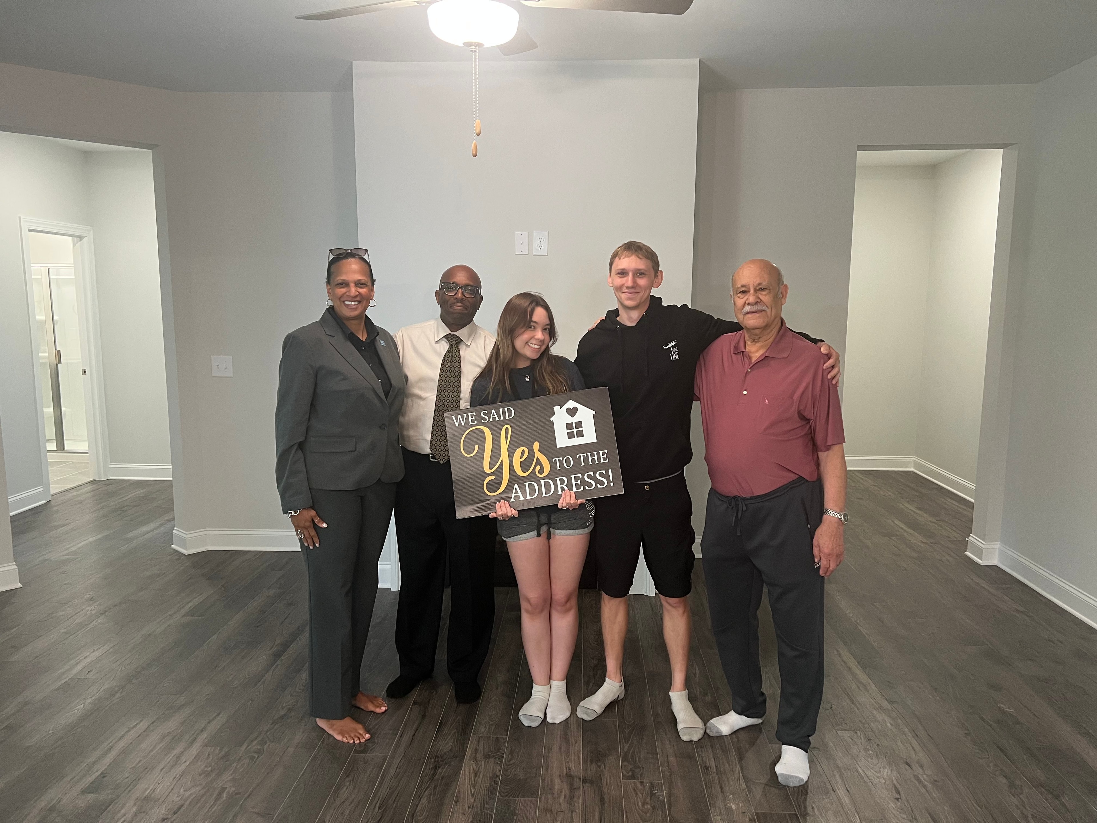 Commission Realty agent with happy clients at closing